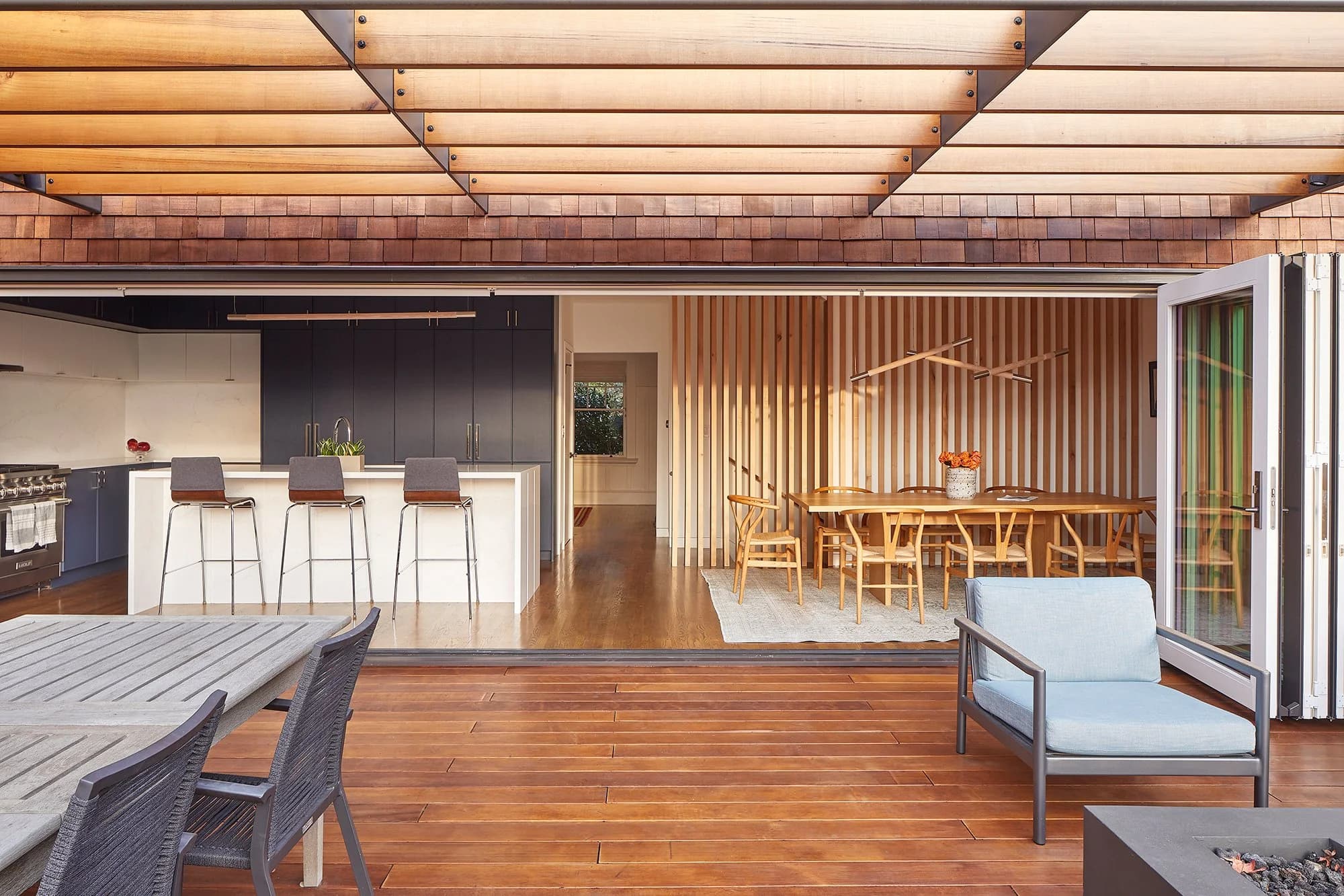 Beatiful hardwood patio with fire pit and tables